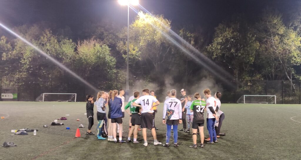 teams gathering after hot night playing ultimate frisbee